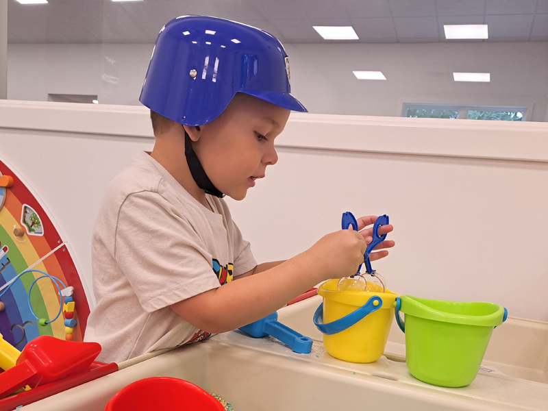 Image of child engaging in sensory play