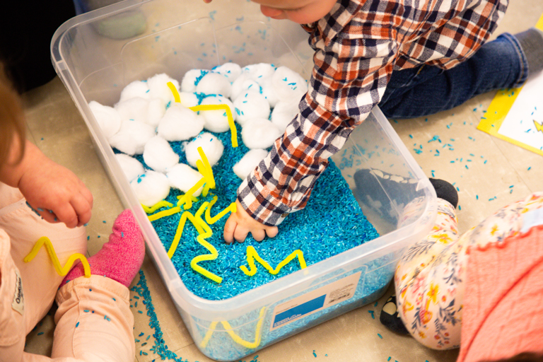 Image of kids playing in sensory bin